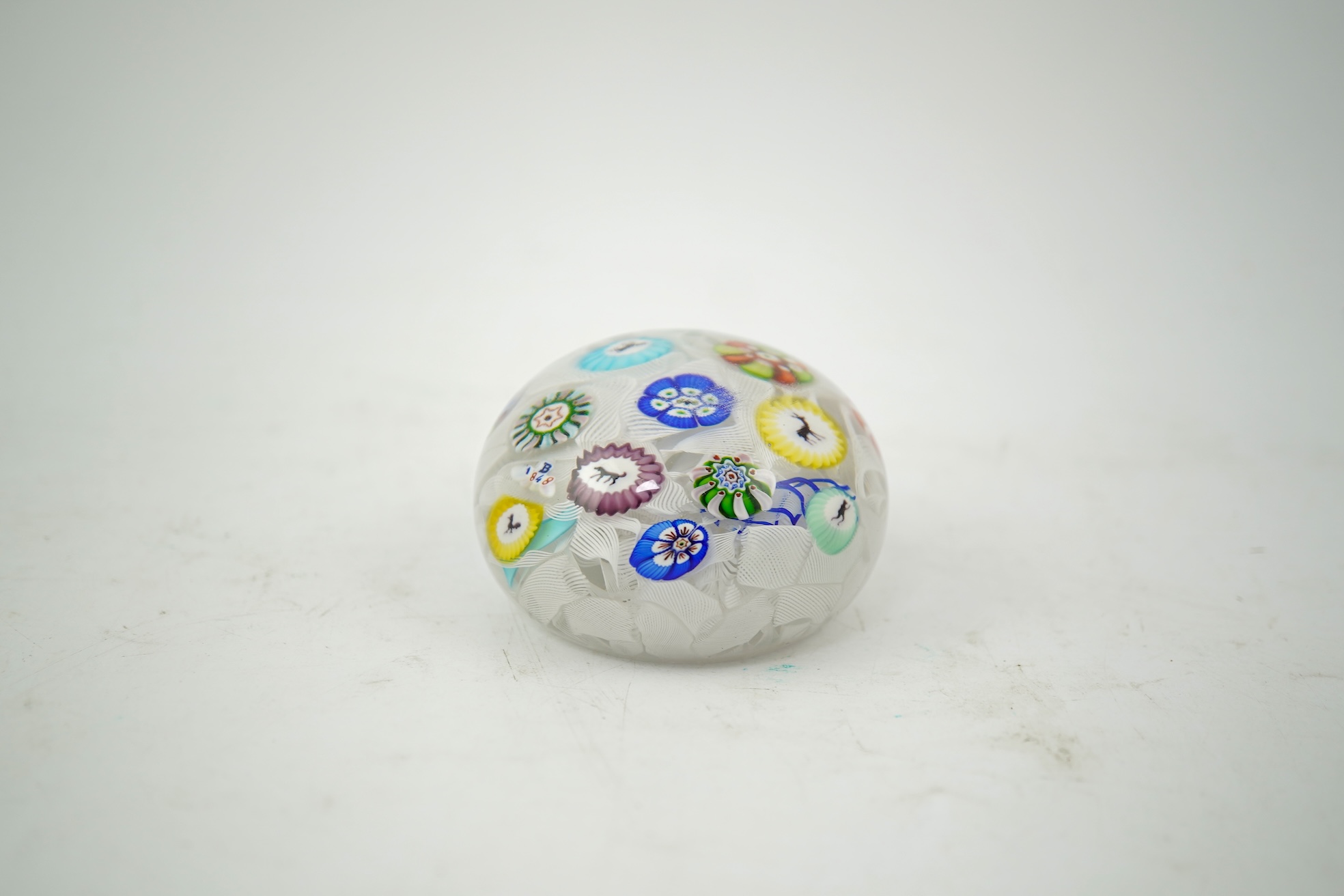 A Clichy piedouche concentric millefiori paperweight, mid 19th century